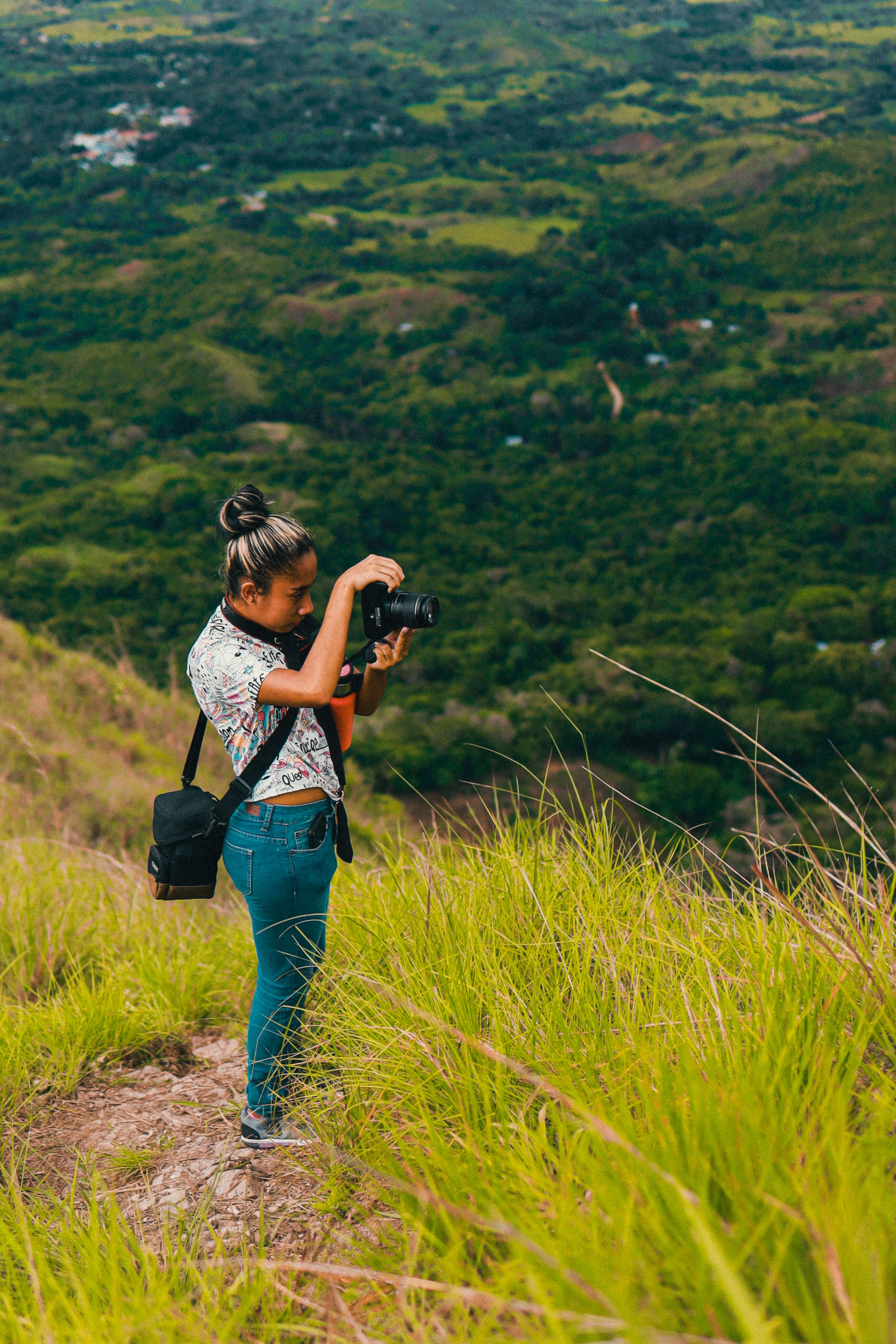 Photographer capturing sunset landscape in desert canyon